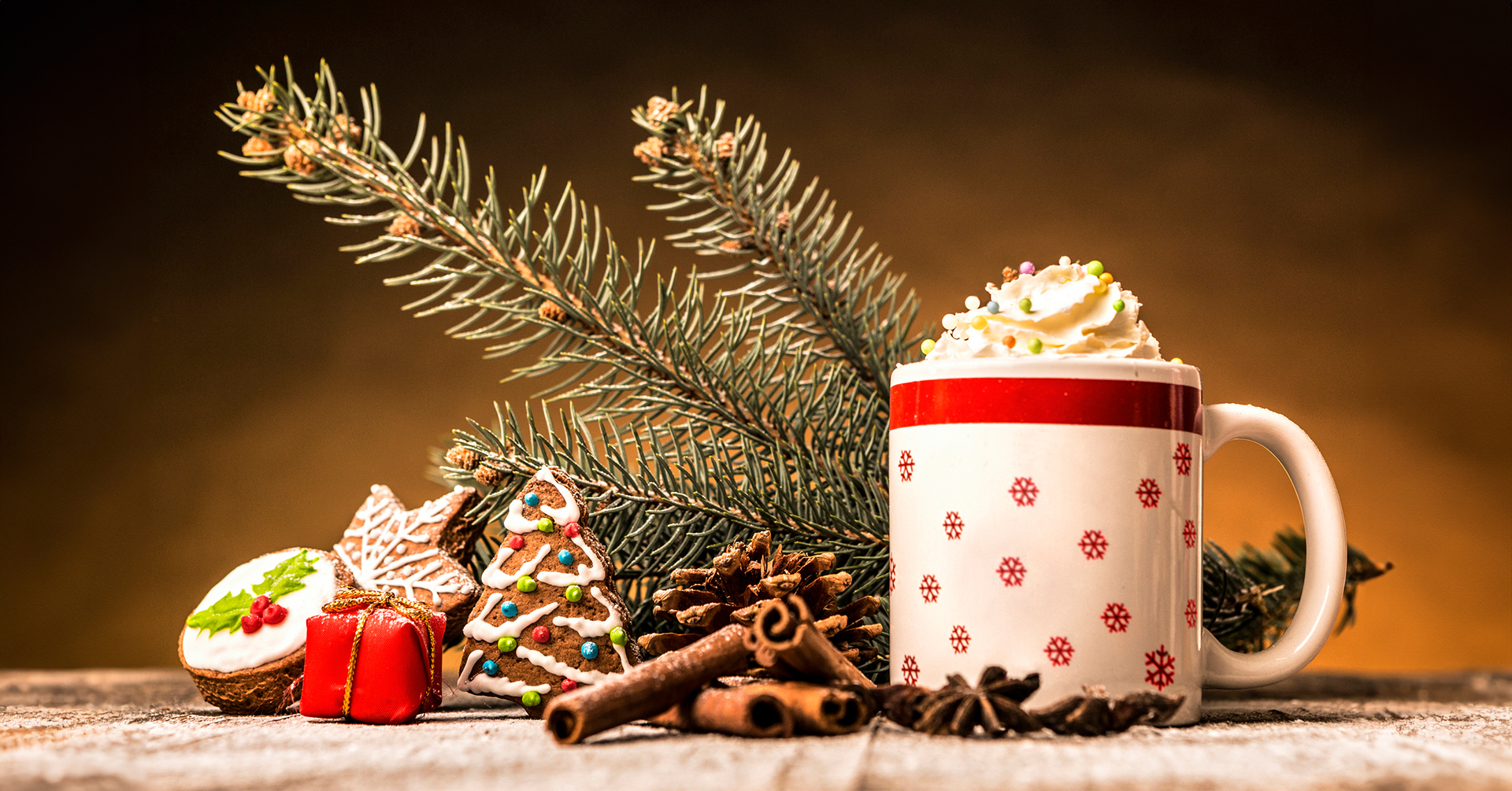 festive holiday table display with festive mug of hot chocolate